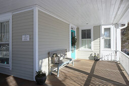 Bench on sunny, American-style veranda