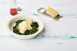 Gratinated mustard salmon on a bed of spinach