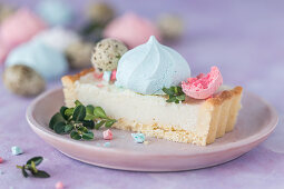 Slice of a Polish Easter cake with colorful meringues