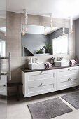 Washstand with square countertop sinks in grey bathroom