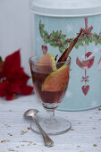 Mulled wine in front of a tin