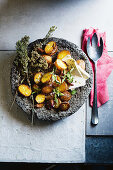 Roast potatoes with oregano and feat