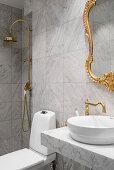 Marble, gilt and brass details in bathroom