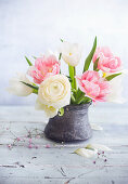 Posy of ranunculus and tulips in vase