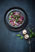 Mushrooms stuffed with spinach and pine nuts on a radicchio salad (vegan)