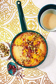 Sticky orange and semolina pudding with rose custard