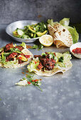 Stacked beef tortillas with avocado salad