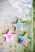 Wooden stars coloured in by children