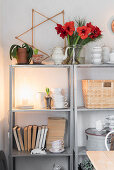 Crockery, books and Christmas decorations on open shelves