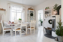 Table and chairs in festively decorated kitchen-dining room