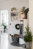 Log-burner in festively decorated kitchen-dining room