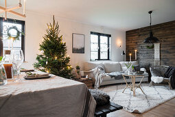 Christmas tree and board wall in cosy interior