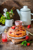 Yeast cake with strawberry and almond flakes
