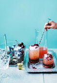 Prosecco punch with vanilla, blueberries and cherries