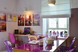 Modern dining room with office area and purple accents