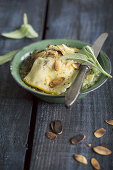 Baked savoy cabbage potatoes with almonds and sage