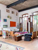 Large, open terrace doors in artistic living room