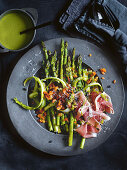 Asparagus salad with green asparagus, Prosciutto and pine nuts