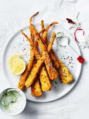 Spicy coated parsnips with herb labneh