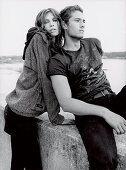 A couple on a wall (black-and-white shot)