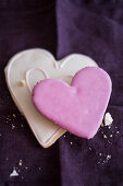 Two heart-shaped biscuits with icing