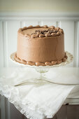 Mocha cream cake on a cake stand