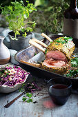 Mustard-crusted veal roast with red cabbage slaw