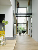 Open-plan, double-height interior of architect-designed house