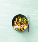 A buddha bowl with tempeh and sprouts