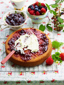 Biscuit cake with berry jam and clotted cream