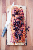 Dry marinated salmon on a plank with cranberry sauce