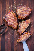 Grilled pork chops with a juniper berry and honey glaze