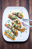 Grilled, stuffed pointed peppers with chicken and goat's cheese