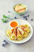 Atayef, small pancakes with semolina cream and orange syrup (Arabia)