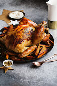 A whole roast turkey with truffle salt and sweet potatoes