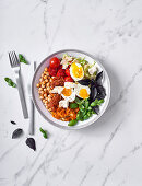 Veggie bowl with chickpeas, boiled eggs and feta cheese
