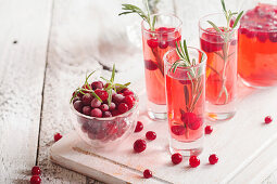 Refreshing drink with cranberries and rosemary