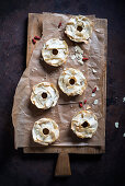 Vegan yufka bagels topped with almonds, goji berries and rice syrup