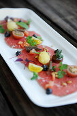 Beef carpaccio with tomatoes
