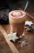 Hot chocolate with cherry sauce and cinnamon stars