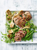 Lamb with roasted artichokes and peas