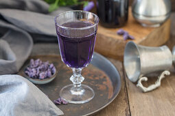 A glass of champagne with violet syrup from Toulouse