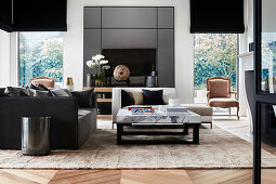 Elegant living room with sofa, daybed and coffee table with marble top