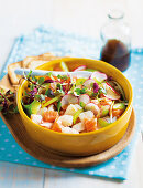 Mixed fish tartare in a bowl