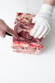 Tough meat being removed from steak
