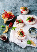 Mini pavlovas with whipped cream and redcurrants