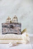 Wooden box and Oriental lanterns on folded blanket