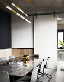 Table with marble top and chairs in the meeting room with sliding door