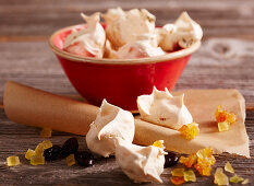 Cherry and orange meringues with orange peel and dried cherries