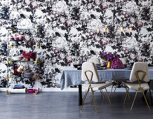 Elegant dining room with opulent floral wallpaper and golden details